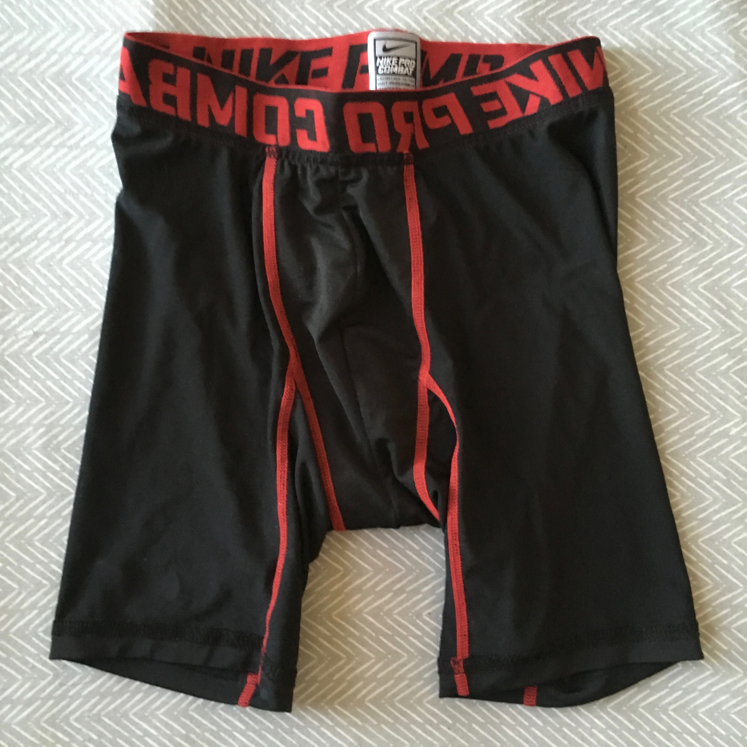 black/red NIKE pro combat compression shorts